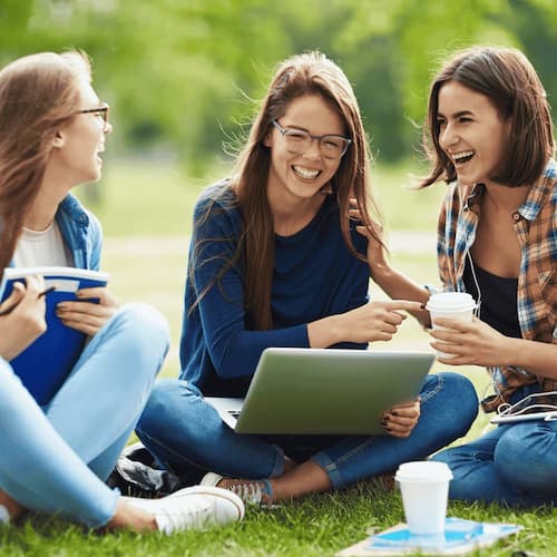Cute girls relaxing outdoors during summer vacation

